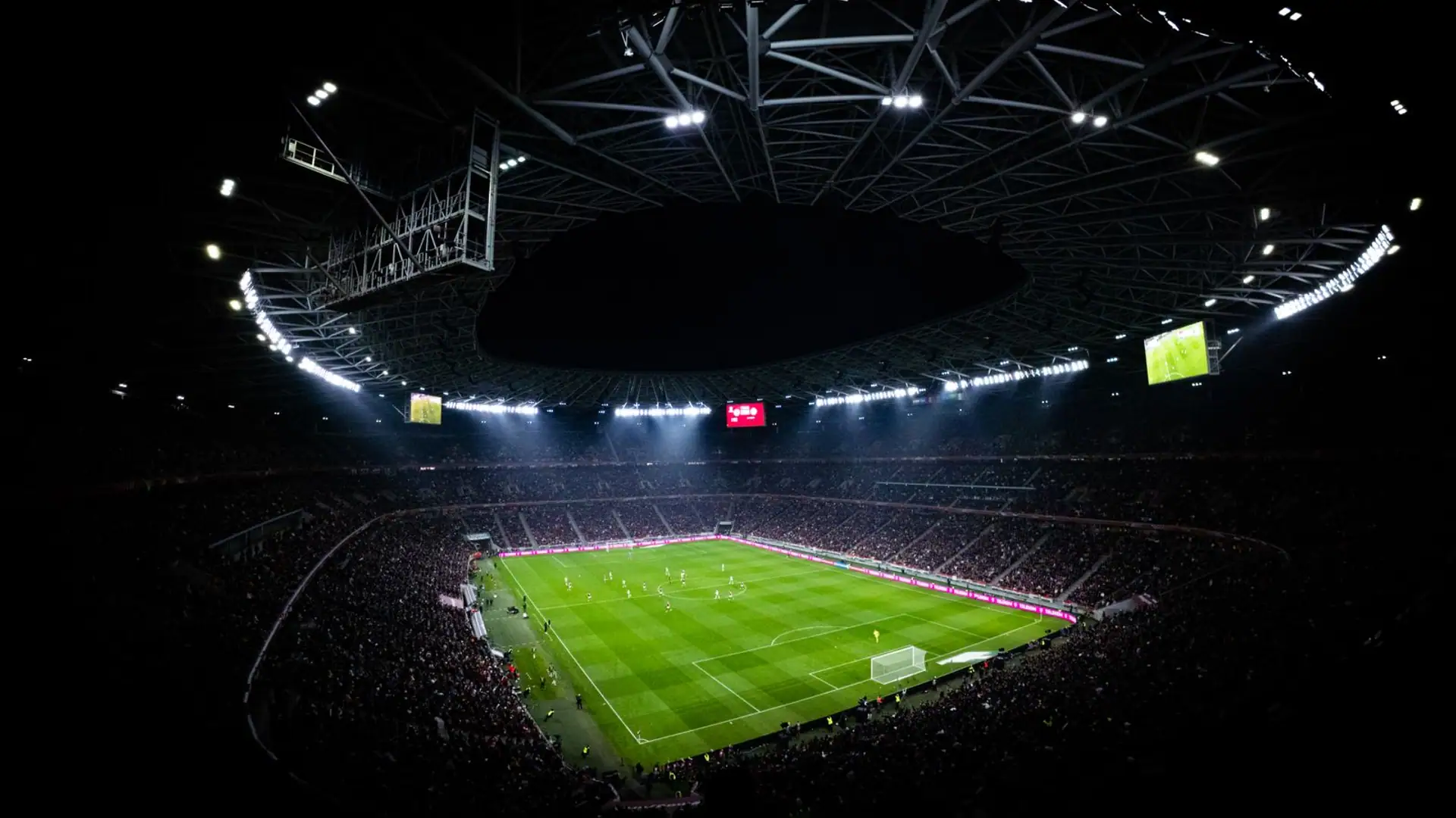 Floodlit stadium packed for a night fixture